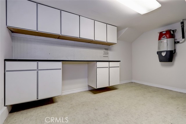Lower level utility room with work bench for the hobbyist. Just off this room is a storage area or wine cellar.