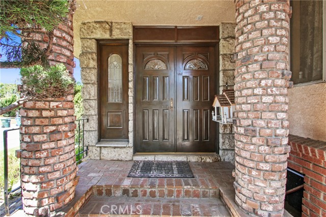 DOUBLE DOOR ENTRY & LOTS OF BRICK WORK