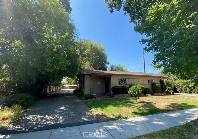 South driveway leads to double garage for front house and 1 bedroom unit with single garage as well as to RV garage and carport.