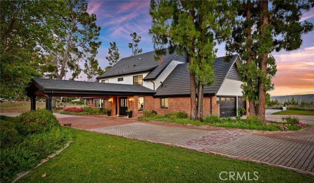 Boasting awe-inspiring views of the Santa Rosa Valley, this private sanctuary offers an unmatched sense of seclusion. Upon entering through the gated entrance and arriving at the secluded motor court, you are welcomed into a setting defined by exclusivity and privacy. This redesigned and remodeled home features 4 bedrooms plus an office, 5 baths, and spans 3,772 square feet. Additionally, a permitted ADU provides 2 bedrooms and 1 bath across 1,200 square feet, all situated on 3.98 acres of mostly flat, usable land with spectacular views from every room.
 
The heart of this residence is the kitchen, which opens to the dining and family rooms. With quartz countertops, updated appliances, and a water softener system, the kitchen is a masterpiece for both amateur cooks and seasoned chefs. The traditional estate has been thoughtfully redesigned to offer large rooms and open spaces, making it a true entertainer’s dream. Amenities include a pool, spa, outdoor BBQ kitchen, and updated tennis, pickleball, and basketball court. Several patios provide the perfect setting for alfresco dining and entertainment, allowing for picturesque gatherings.
 
The expansive property features multiple entrance points on Presilla, ample flat and usable space, a two-stall barn, and a chicken coop with room for more. It offers everything one could desire in a private ranch estate of this magnitude. Whether you seek a peaceful retreat, an entertainer’s paradise, or a family haven, this property fulfills every desire.