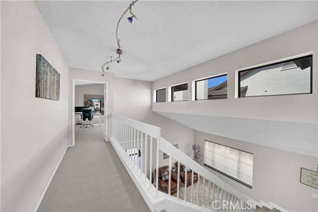 Upstairs is a Catwalk Landing with Transom Windows for Lots of Natural Light Throughout Home