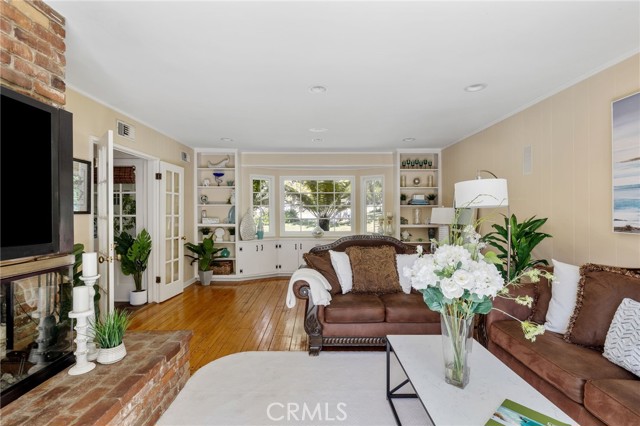 Bright and beautiful bay window with so much shelf and cabinet storage.