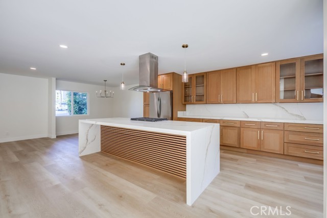 Beautiful Waterfall Edge Countertop with Custom Decorative Wood Treatment.