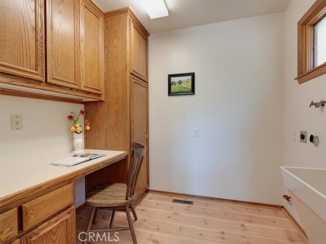 Laundry Room is adjacent to kitchen area.