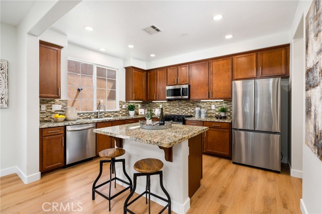 Beautiful kitchen with brand new stainless steel Samsung appliances.