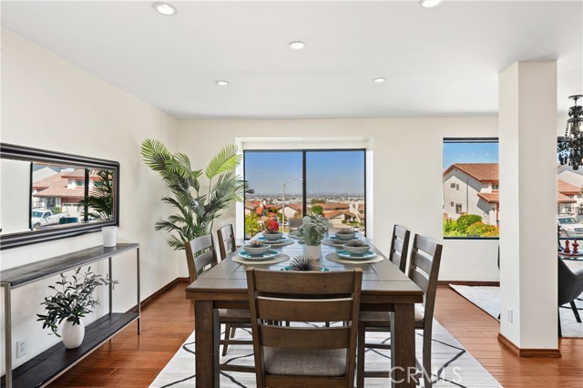 Dining area at one end of the Great Room and adjacent to the Kitchen peninsula.