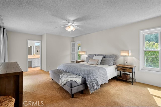 Primary Bedroom with Walk-in Closet and Ensuite Bathroom