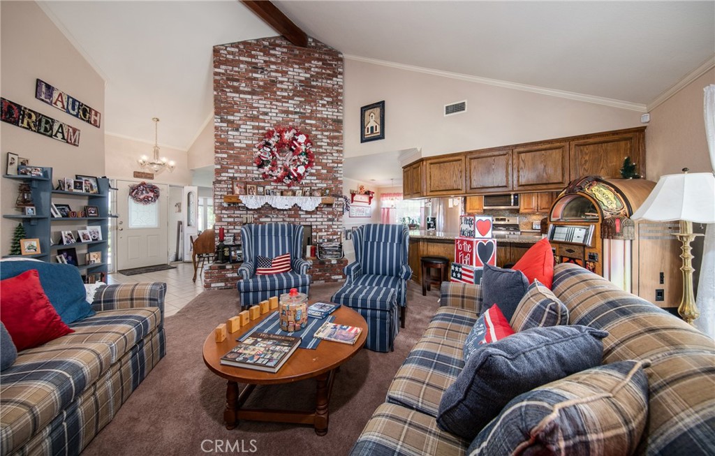Family Room to Kitchen and Entry way with Living Room beyond Kitchen