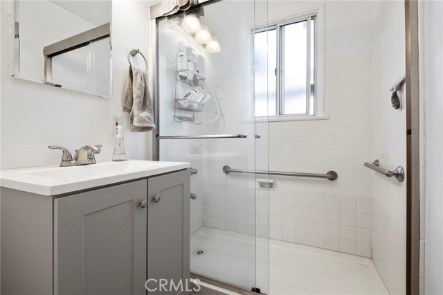 Newly Remodeled Bath Room with Handrails in the Tub/Shower.