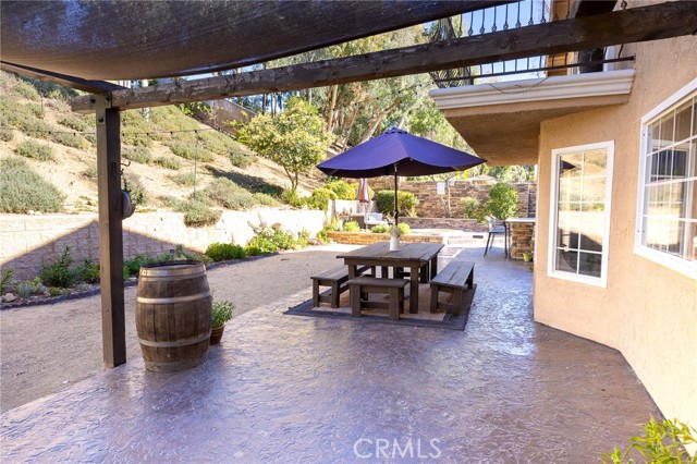 Stamped colored concrete adds to the rustic outdoor look.