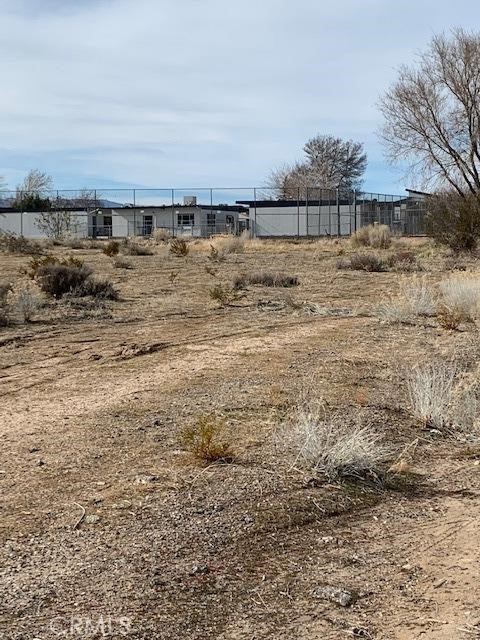 Lot between property and School