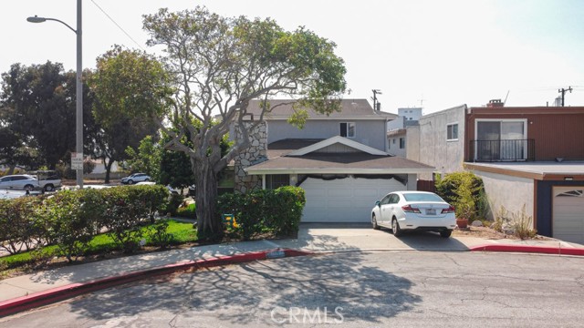 The front unit looks like a regular 4 bed home with a 2 car garage