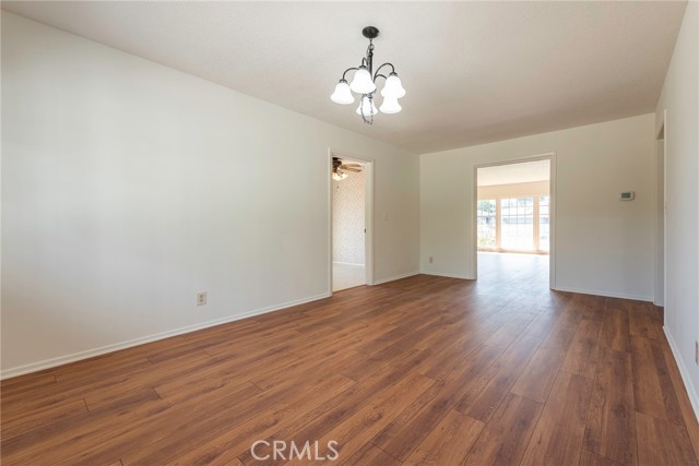 Dining room facing into living room and kitchen doorway