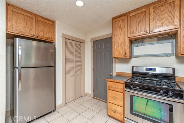 Kitchen - Light Brown Door is Pantry/Closet, Blue Door is Garage Entry