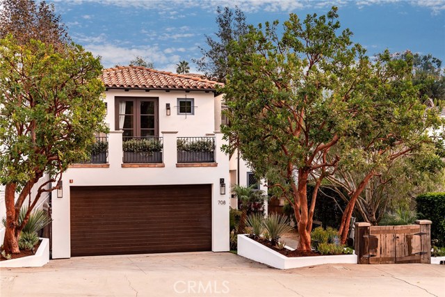 708 Marine Avenue Manhattan Beach, California Situated on one of the most desired blocks in the Grandview tree section, this authentic Montecito inspired home was custom built in 2006 and has been completely updated over the past two years. The optimal floor plan features a massive great room/kitchen combination on the main level and all bedrooms upstairs. The kitchen is that of a chef’s dream; it has been newly remodeled and comes fully equipped with top of the line finishes. The kitchen’s best features include new custom cabinetry, marble countertops, a large-scale island with extensive storage, a sub-zero refrigerator, and a Wolf range. Beyond the kitchen, fully retractable bi-fold doors open up to a uniquely designed interior courtyard which allows for year-round indoor/outdoor living. The other side of the yard offers two additional entertaining areas which are privatized by an ultra-zen bamboo arrangement. Back inside, a walk up the stairs leads to an open landing that enjoys a lookout over the foyer. The upper floor is comprised of four sizable bedrooms and a large office highlighted by the hand distressed hickory floors. Enjoy a spa-like experience in the master bath which features a dual vanity, a vintage soaker tub, and a custom tiled shower. Additional upgrades in the home include new central A/C, Ring cameras, hard wired security, Sonos system, and new interior/exterior paint. This A+ location is a short walk to town, the green belt, Grandview Elementary, and it is only six blocks from the beach!