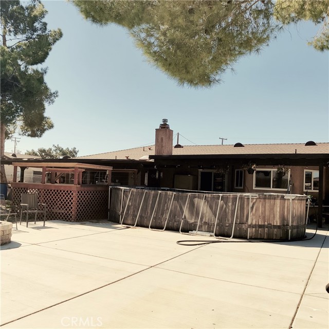 Above ground pool with custom deck