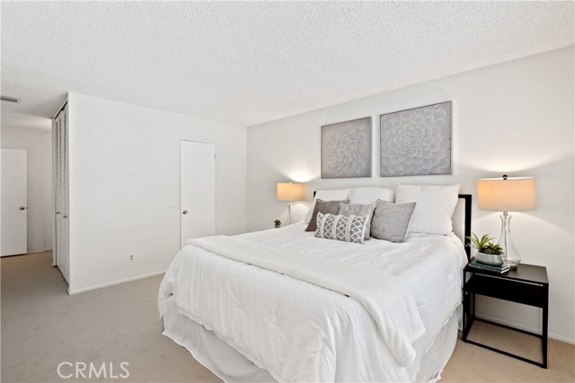 The primary suite is a spacious bedroom closet, and primary bath with dual vanities.