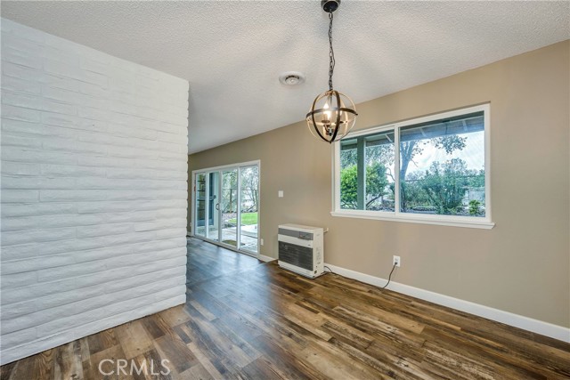 Formal dining room with monitor heating between the living room and dining space.