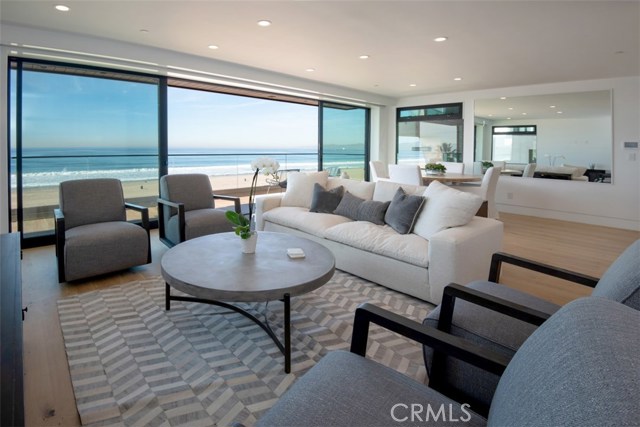 1208 The Strand B Manhattan Beach, California Newly priced with an incredible opportunity to live directly on The Strand! This beautiful modern luxury unit provides unobstructed views of the ocean as far as the eye can see. Only a few feet to the sand with the Manhattan Beach Pier in the near distance, this extensively remodeled unit boasts high-end finishes throughout. As you enter, the bright and open floorplan guides your eyes straight through the double sliding glass doors directly to the ocean. The elegant living room with dining area steps out onto the balcony with amazing panoramic views which is elevated above The Strand providing added privacy. The well-appointed kitchen features bar seating, Wolf range, custom cabinetry, and Carrara marble back splash. The main suite includes dual closets and a sophisticated bathroom with tiled walls and glass shower. Additional second bedroom with natural light and designer guest bath. This is 1 of 3 units in a newly remodeled building. Relish in the added features of a two-car garage, in unit laundry, AC, secured entrance, dual pane windows, and wood plank flooring. Enjoy warm ocean breezes in this refined condo in the Sand section of downtown Manhattan Beach. Be a part of a vibrant oceanside community with boutique shops, acclaimed eateries, and a true local feel.