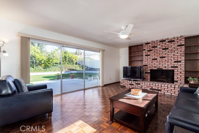 Family room, adjacent to the dining room and back yard access.