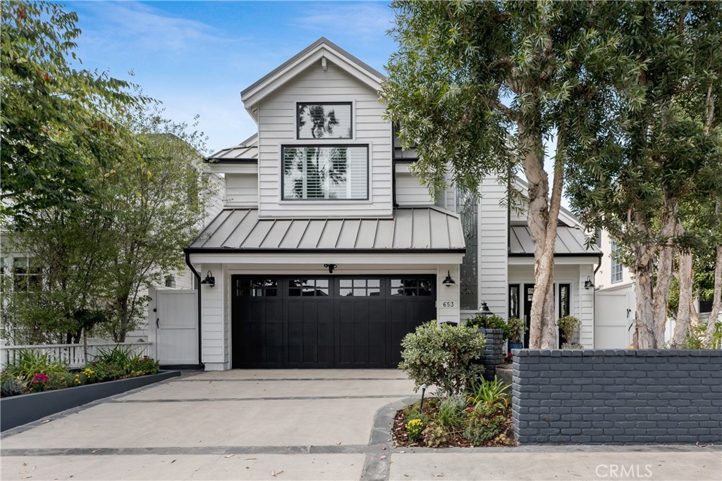Located on one of the most coveted blocks of the soft glowing gaslamp neighborhood lined with iconic eucalyptus trees, this stunning home embodies the storied essence of the Tree Section with a crisp white shiplap coastal vibe. As you enter through the inviting dutch door, you’ll experience high ceilings, natural sunlight streaming through the skylights, and an overall sense of comfortable volume and spaciousness. Home has become the center of both home life and work life - here you can have it all.  Ahead of its time in design with three living areas, this home provides maximum flexibility with multiple spaces to come together or work separately.  Downstairs features the main living areas, two bedrooms and a flex/media/teen room/office that flow out to an entertainer’s yard complete with a spa, outdoor kitchen and retractable awning. Upstairs you’ll find another large family room with a built-in desk, bedroom with an ensuite bath, laundry room and primary suite with two walk-in closets and spacious bath.  Everyday comforts include wood flooring throughout, updated kitchen and baths, air conditioning, security cameras, 4 car parking, and Sonos speakers for seamless enjoyment of indoor-outdoor sound.  This is a perfect Tree Section location near Grandview Elementary, Sand Dune Park and the beach.
