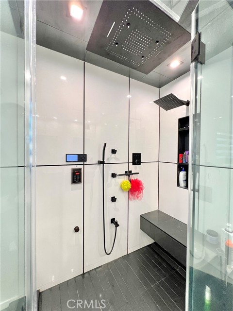Steam shower with integrated speakers