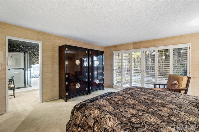 The main bedroom is a large suite with a spa-like en-suite bath.