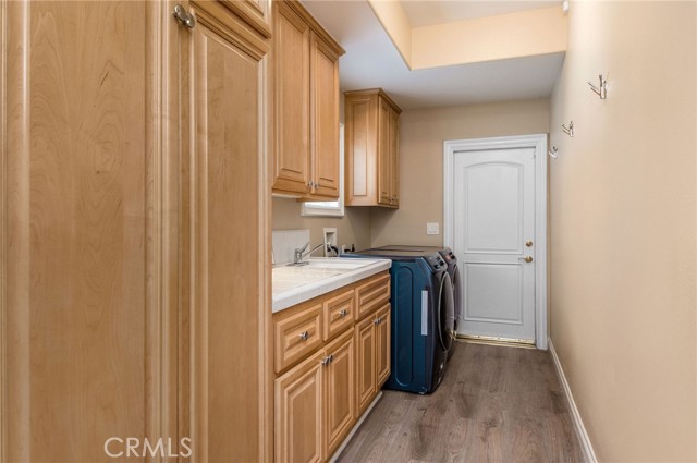 The laundry room has storage and space for allyour clothes. The laundry room has storage and space for allyour clothes.