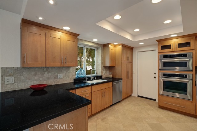 Shaker style cabinets and pantry.