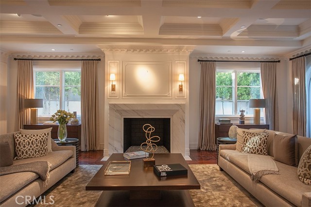 813 N Alpine Drive Beverly Hills, California Luxuriously updated 11,000 square foot estate located on The Flat showcases refined materials, exquisite finishes, and impeccable decor throughout. Breathtaking grand entry with cathedral ceiling and dual staircase welcomes guests to a six bedroom, ten bath, custom appointed residence offering the epitome of luxury and grace. Enjoy the lavish chef caliber kitchen with designer-selected finishes, high-end appliances, custom cabinetry, oversized center island, butlers pantry and ample space to entertain. Formal living room, dining room, wine cellar, bar, and media room are ideal for entertaining large crowds or intimate gatherings. Impressive master suite offers a fireplace, dual custom closets, and relaxing spa inspired bath. Two bedrooms are conveniently located on the main floor, as well as fitness room and sauna. Tranquil grounds are beautifully landscaped and highlighted by outdoor patio, pool, spa and fireplace. Dont miss the exceptional quality and rare beauty that is being offered.