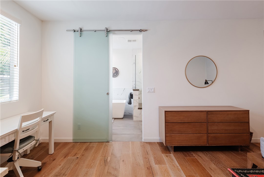 Primary bedroom transistion to Primary bath-glass barn door