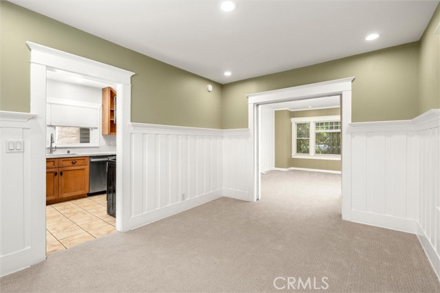 Wonderful wainscoting in the Dining Room off the remodeled kitchen. New carpet and designer paint.