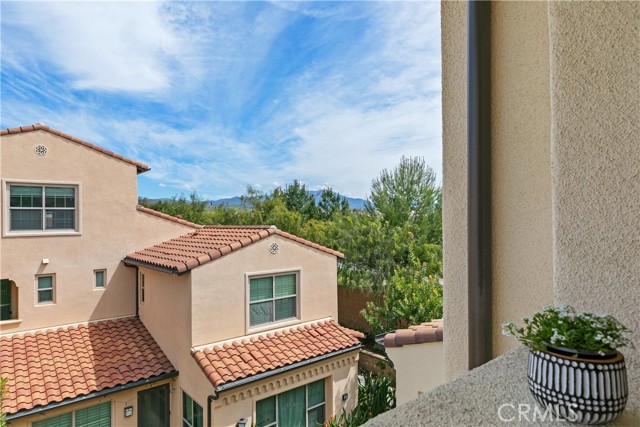 Private balcony provides a serene peek-a-boo mountain view.