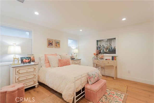 This secondary ensuite bedroom is thoughtfully styled with charm, warmth, and a soft inviting ambiance for every little girl to feel safe and creative.