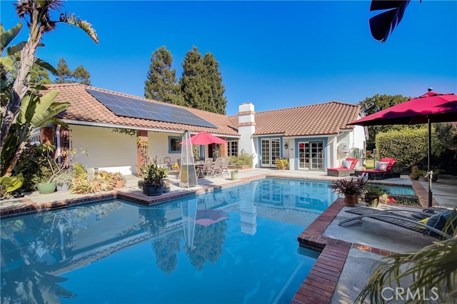 This is your view when you walk in the entry gate of your glistening pool, spa and home.