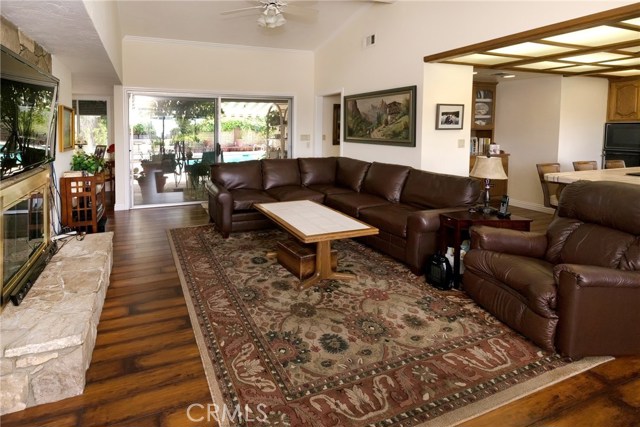 Family Room, double sided fireplace and kitchen to right