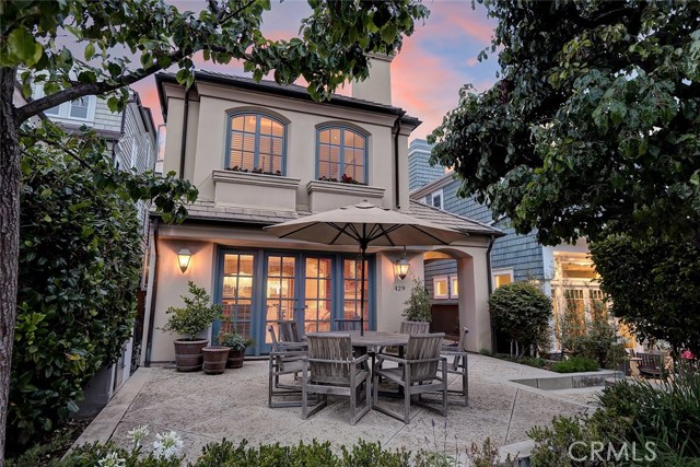 429 5th Street Manhattan Beach, California Lightly influenced by timeless French countryside estates, this home was built custom by original owners. A formal entry is greeted by a winding staircase and 2-story ceilings. The formal dining area is open to the living room and is accented by a natural stone wall. The living room features a wood-burning fireplace that is flanked by library shelving and French doors that open to the generously sized sunny, south-facing front patio. The patio sits high, overlooking the walk-street beyond and enjoys partial shade from mature trees. The highly functional kitchen features clever details such as a built-in desk area/homework station, double-door pantry and pocket wine storage! All bedrooms & laundry room are on the upper levels. The private master suite features a fireplace, bonus built-in storage cabinets, and a high, tray ceiling with ambient lighting detail. An expansive dressing room features built-in dressers, cabinets and abundant closet space. The master bath showcases an enormous walk-in shower with dual shower heads and pocket shelving. 3 addt'l bedrooms have walk-in closets. A full bath and library/home office area also on same level. A 3rd floor guest suite has a living room, full bathroom and large, private deck; great for multi-generational living. This section of 5th Street enjoys the benefits of walk-street living combined with little foot traffic and drive traffic. With a WalkScore of 86, it’s an ideal Sand Section location just steps from Robinson elementary!