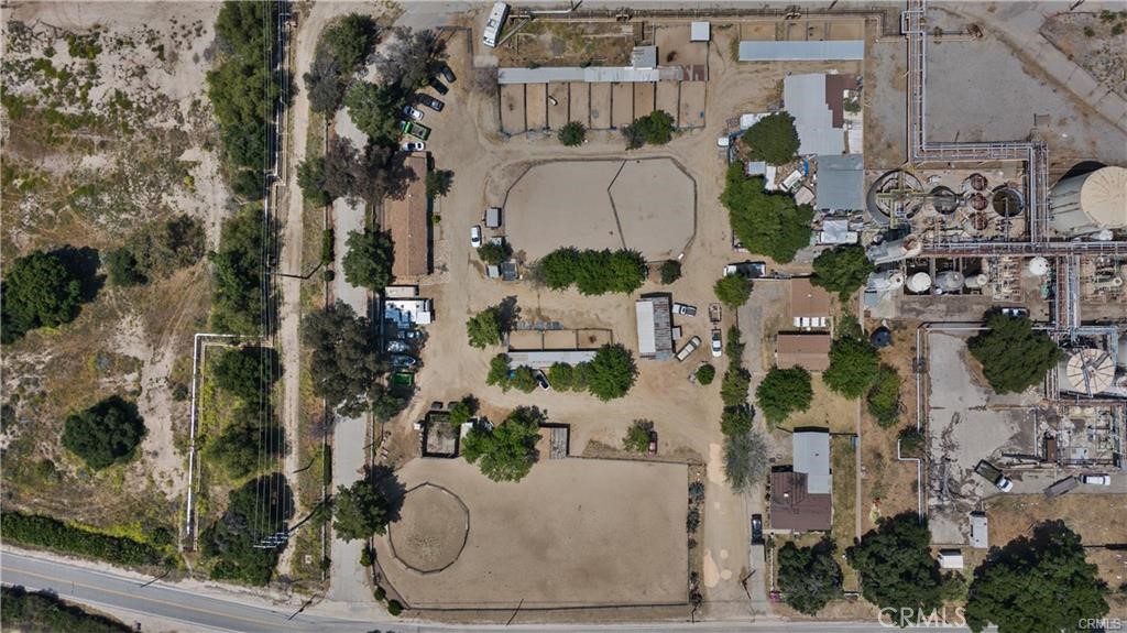 This exceptional offering presents an unparalleled opportunity nestled in the picturesque Placerita Canyon of Newhall, California. Boasting a blend of residential and mixed-use parcels, this property epitomizes potential and versatility. Comprising two parcels, including a residential and a mixed-use lot, this listing is a rare find in a coveted locale.

Residential Parcel:
The residential parcel, sprawling over 29,024 square feet, features a charming 1-bedroom, 1-bathroom home alongside an additional 1-bedroom, 1-bathroom dwelling. Each residence is accompanied by its own detached 2-car garage, providing ample parking and storage space. Embraced by verdant yards, the property also includes an open workshop area and a barn, enhancing its appeal for various lifestyle preferences. While the property may require some tender loving care (TLC), the canvas is primed for customization and enhancement, making it an ideal opportunity for the discerning buyer seeking to craft their dream retreat in an idyllic setting.

Mixed-Use Parcel - "Placertia Stables":
Presenting the esteemed "Placertia Stables," the mixed-use parcel sprawls over 2.816 acres and currently operates as a thriving horse ranch. Embodying the essence of equestrian living, this parcel features a permanent building housing an office and a 3-car garage. The established business, under the moniker "Placertia Stables," offers a turnkey operation for equine enthusiasts or entrepreneurs seeking to capitalize on this thriving venture. Moreover, the expansive lot presents abundant opportunities for expansion and diversification, promising a lucrative investment prospect for the astute buyer.

Appointment Required:
To appreciate the full scope of this remarkable offering, appointments are required for property viewings. Please refrain from unauthorized access and kindly schedule an appointment to explore the boundless potential of this unique property. Do not disturb tenants or horses.

In Summary:
Seize the opportunity to own a piece of Placerita Canyon's rich landscape with this unique property offering. Whether you aspire to create a bespoke residential haven or capitalize on the burgeoning equestrian market, this property presents endless possibilities for growth and prosperity. Don't miss the chance to make your mark in this coveted locale. Schedule your viewing appointment today and embark on a journey towards realizing your vision in the heart of Newhall, California.