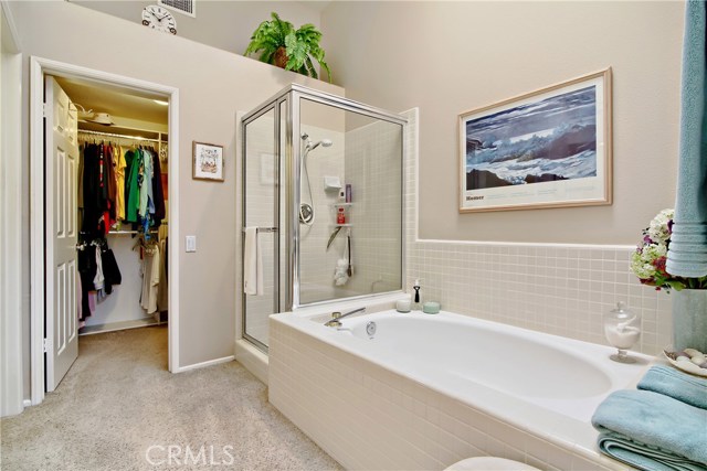 Master bath w/ separate tub and shower...Walk in closet