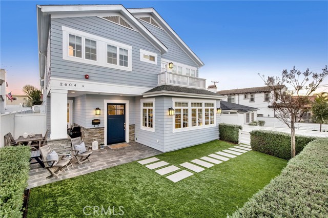 Turf yard with flowering shrubs give privacy and natural beauty.