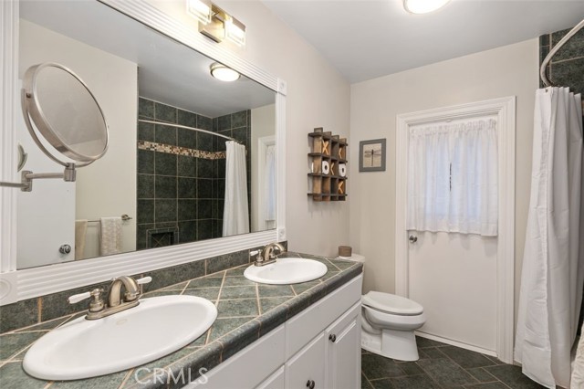 Hall bathroom with access to side yard