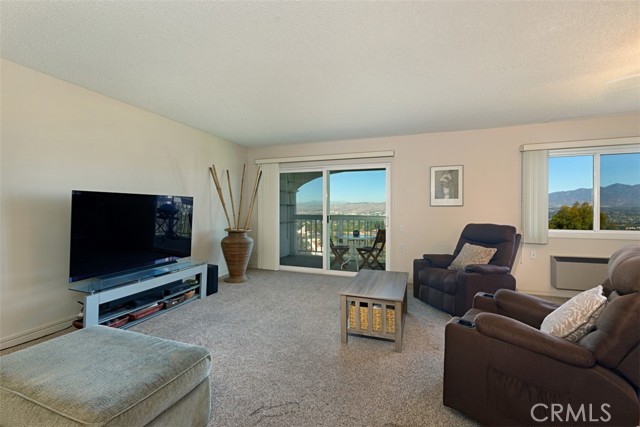 Offering Pano views and sliding glass doors to the enclosed patio!