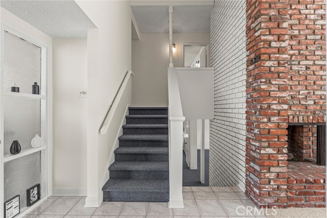 Stairway on left to bedrooms, stairway to right leads to bonus/family room