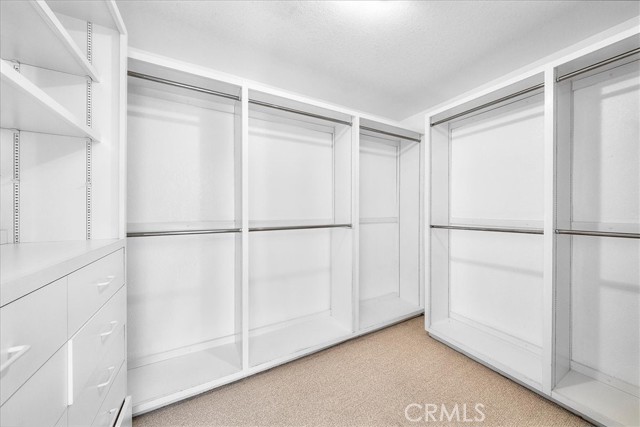 walk in closet in primary bedroom