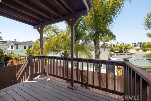 Income Unit: Bedroom 2 Balcony w/ stairs down to the yard