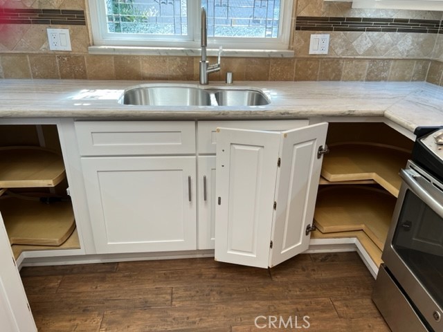 Two corner lazy Susan cabinets.