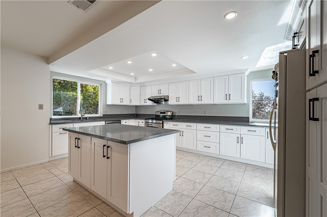 KItchen w/coffered ceiling and tile floor