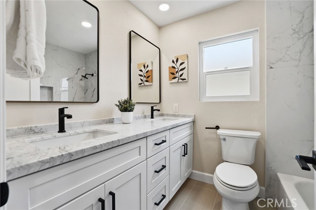 The guest bathroom has the expensive marble countertop with dual vanities.