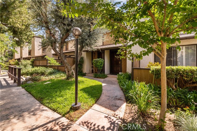 18223 Soledad Canyon Road 54 Canyon Country, California Rare opportunity in the Canyon Crest tract community Townhome! This popular double-master 2 bed, 2 1/2 bath, 2-Story end unit offers only one common wall, a large wraparound patio and direct access 2-car garage with laundry. Additional features include; stainless steel appliances, Nest Thermostat, newer Wifi/Bluetooth enabled quiet garage door opener, laminate flooring and plantation shutters on the 1st floor, under stairs storage/shelving, high ceilings in both master bedrooms and both master bathrooms offer skylights. The Canyon Crest community is known for their rocky creeks and water features and lush green surroundings and also offers a community pool and jacuzzi.