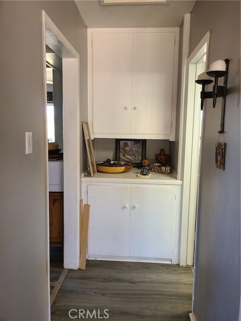 Hallway between kitchen and bathroom